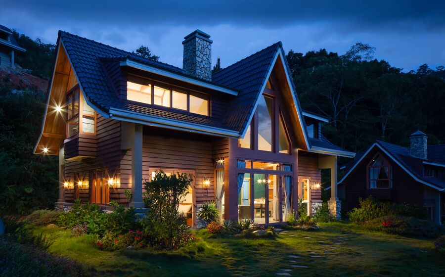 Elevate Property Group website — illuminated residence at dusk