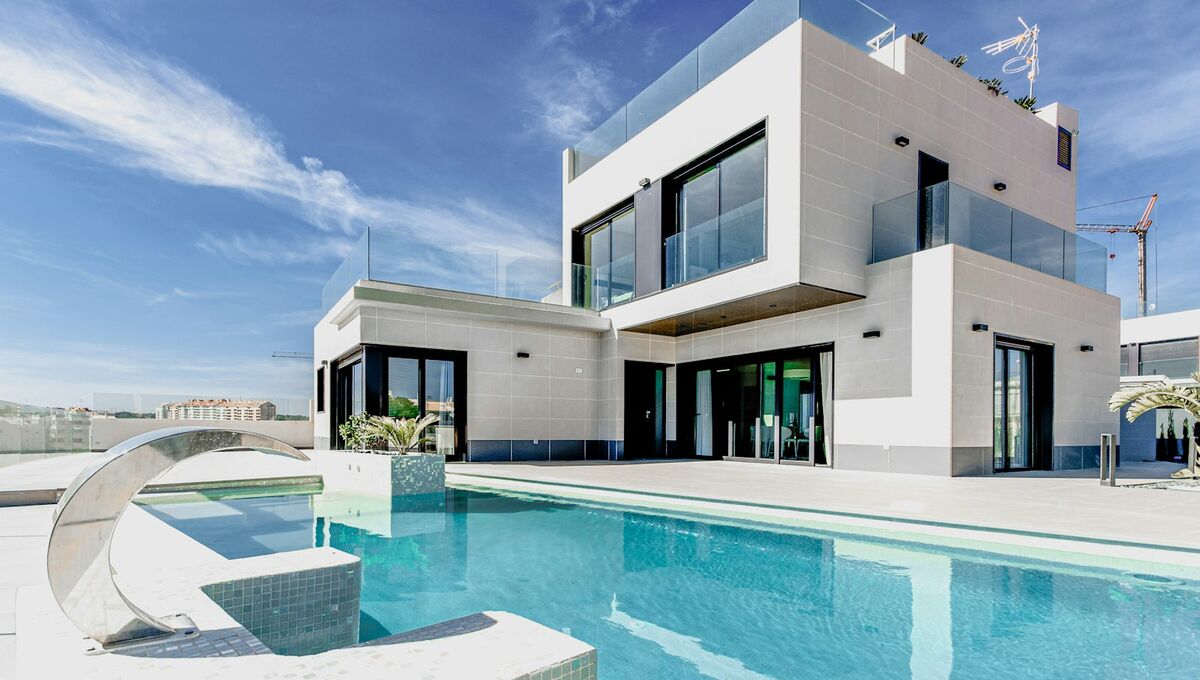 The Aurora Residences website — contemporary villa with a pool